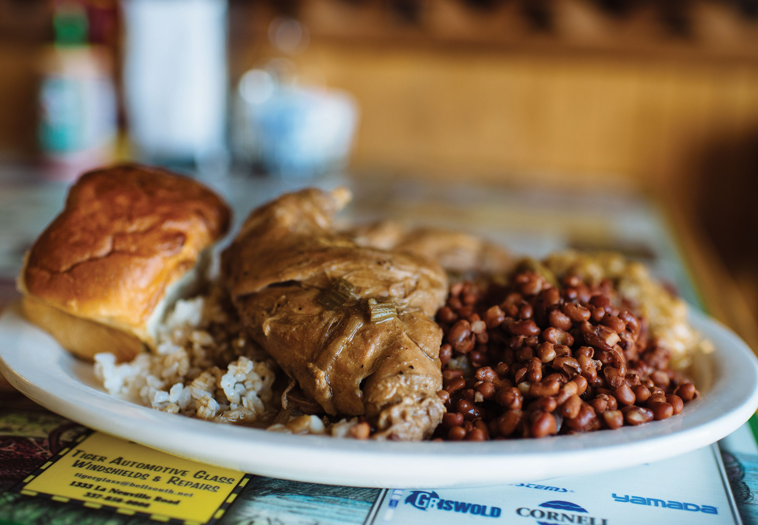 T-Coon's Plate Lunch White plate of soul food piled with beans, rice and bread