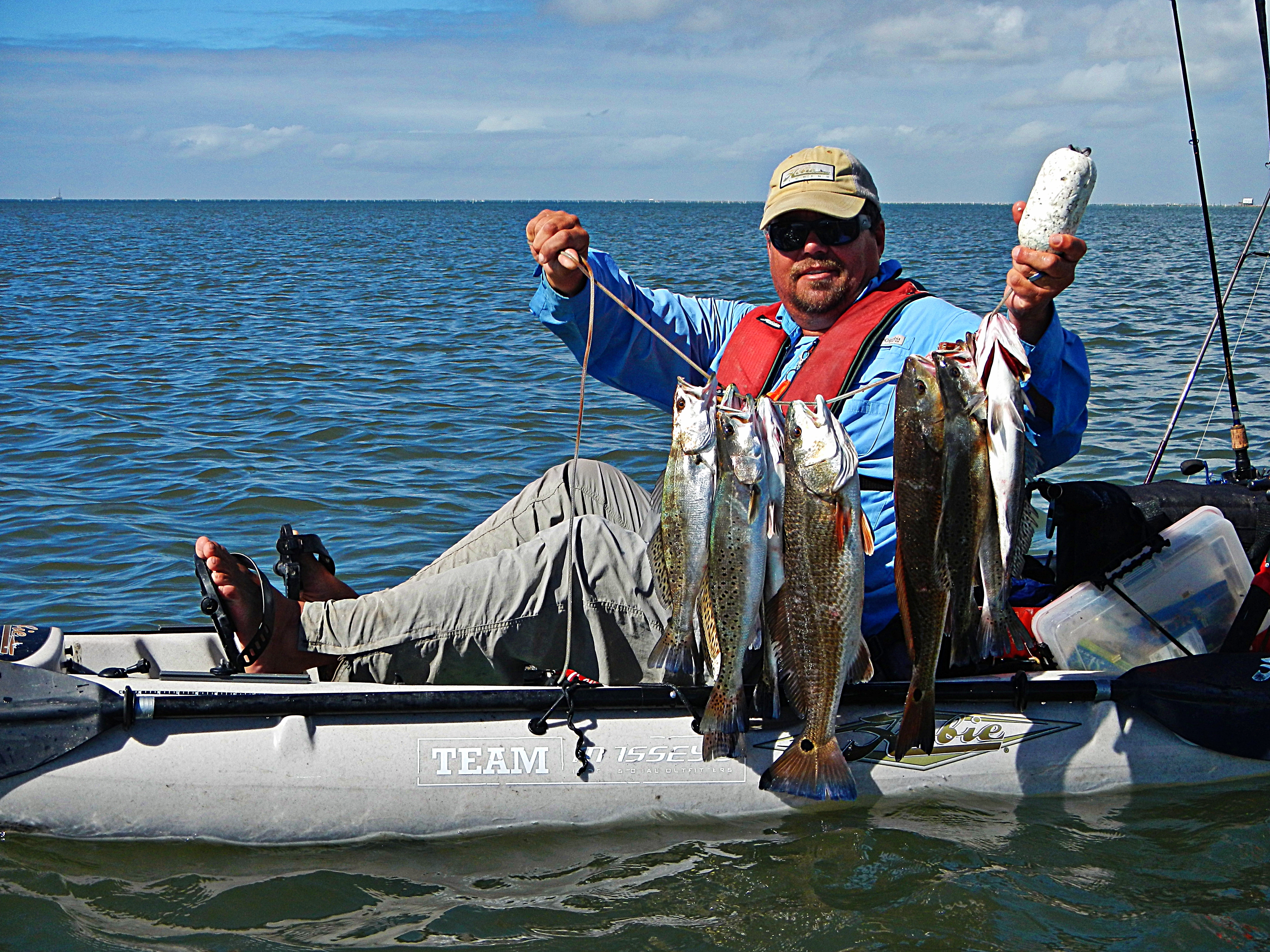 Catching fish from a kayak in Grand Isle, Louisiana