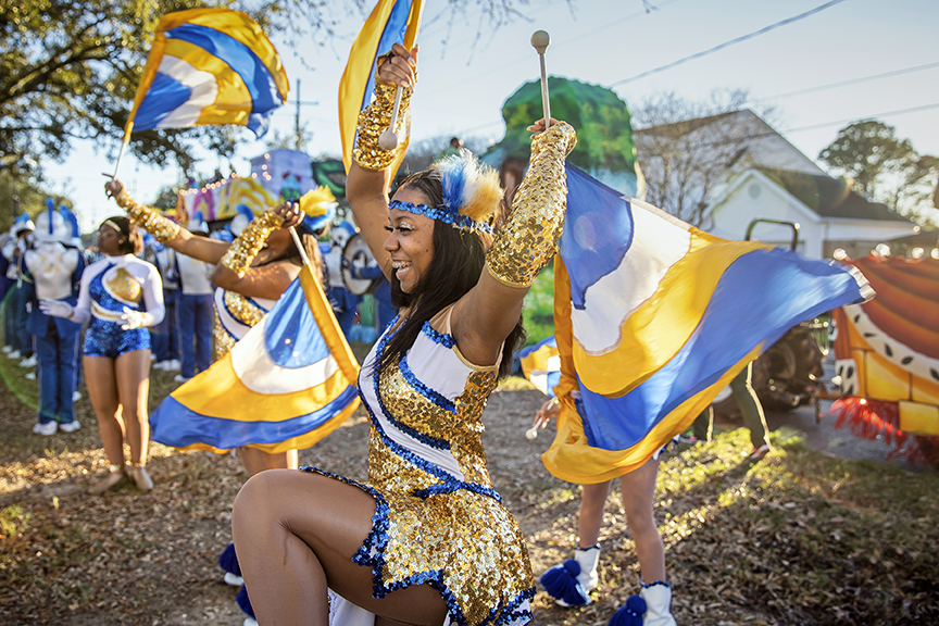 Flag twirler in Krewe of Kings parade