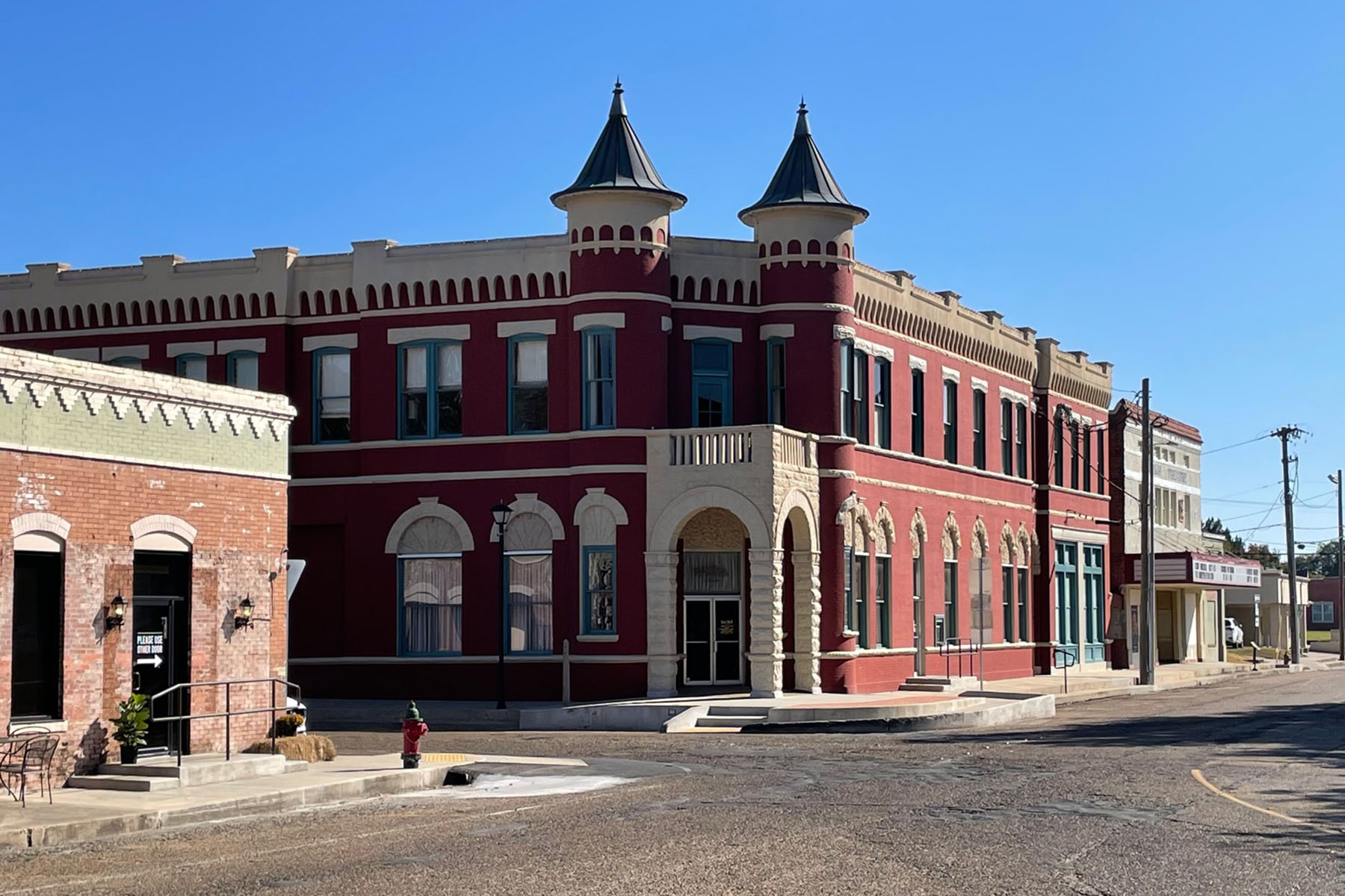 An angled view of a red building in downtown Abbeville, La.