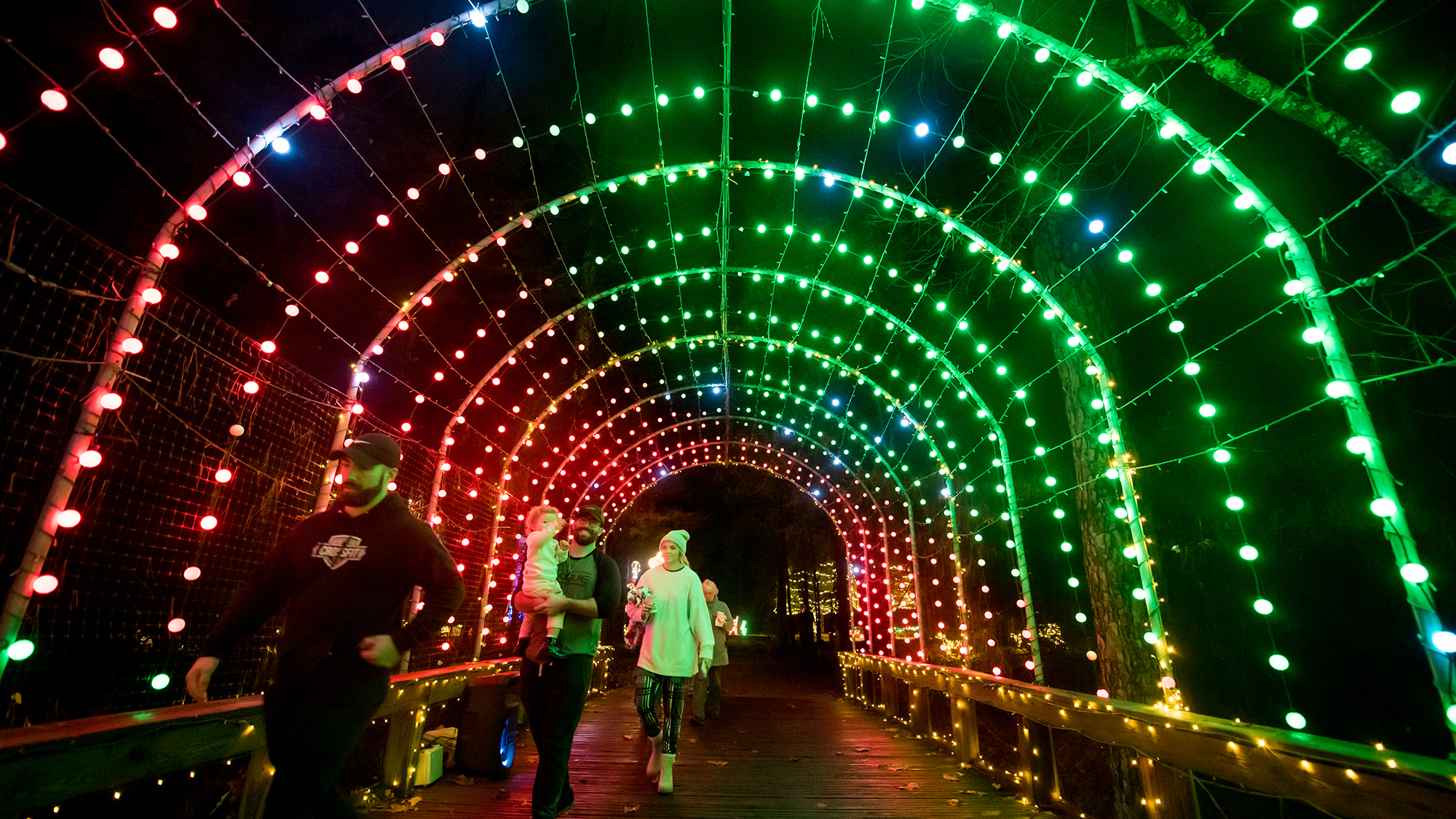 A brightly lit arched walkway during Christmas in Roseland, Louisiana.
