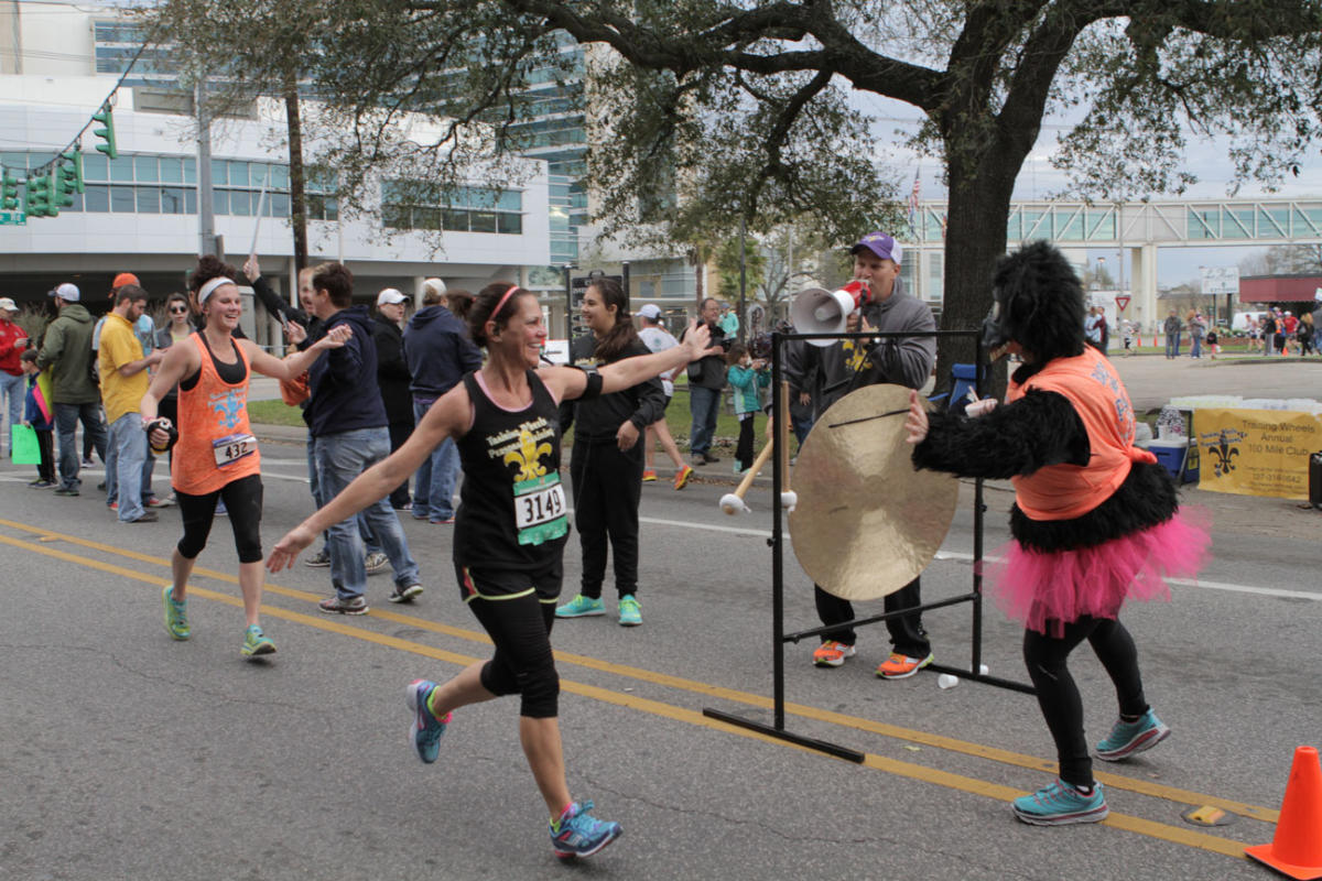 A person crosses the finish line of the Zydeco Marathon.
