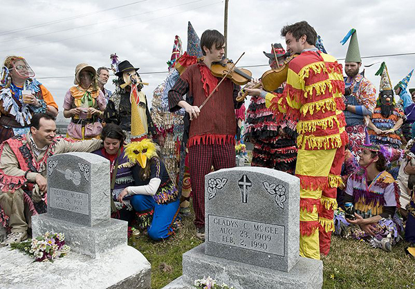 WIKIMEDIA COMMONS. Musicians Playing at Dennis McGee's Gravestone, 2009.