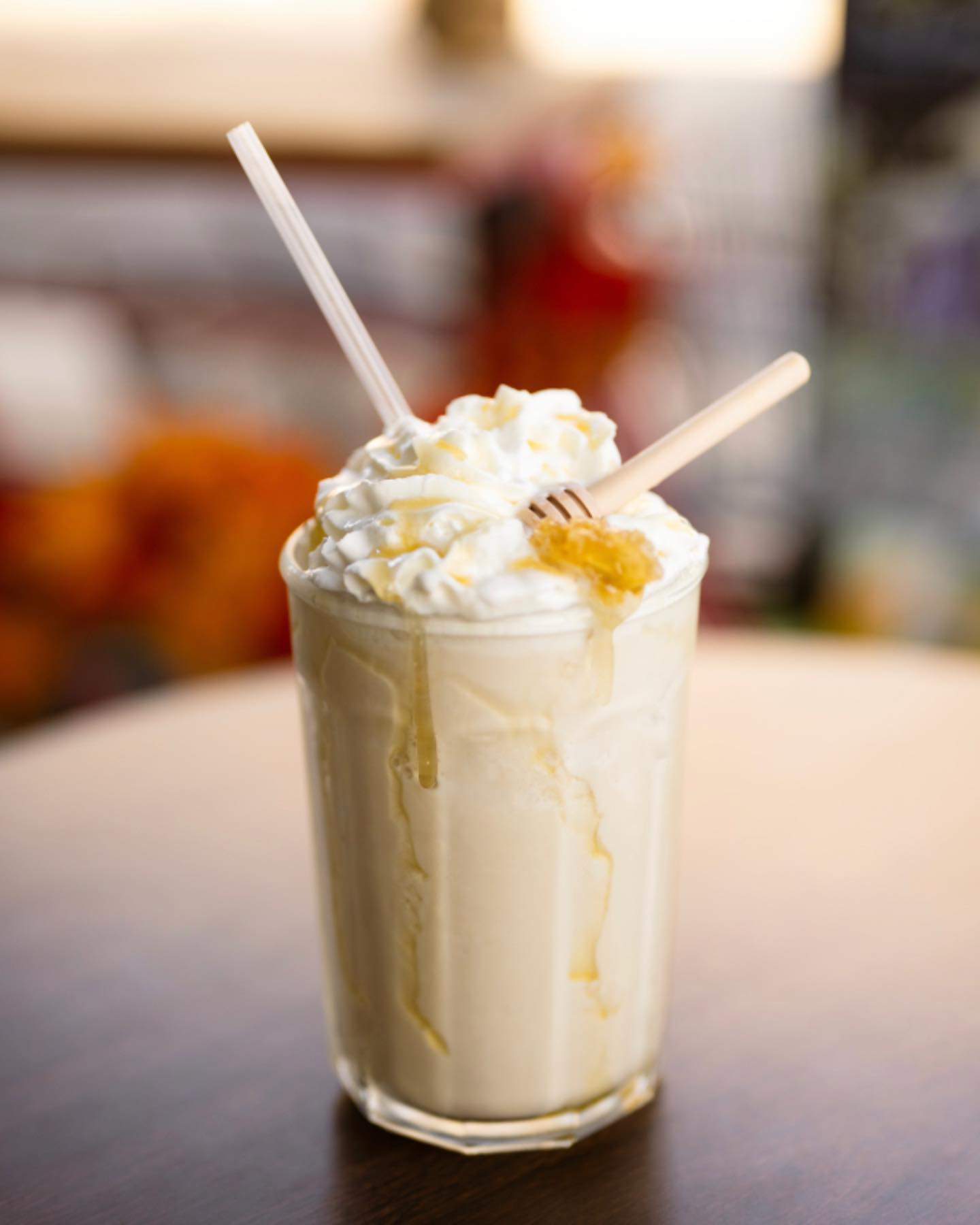 A portrait of a honey-drizzled frappe at Tamp & Grind Coffee in Alexandria.
