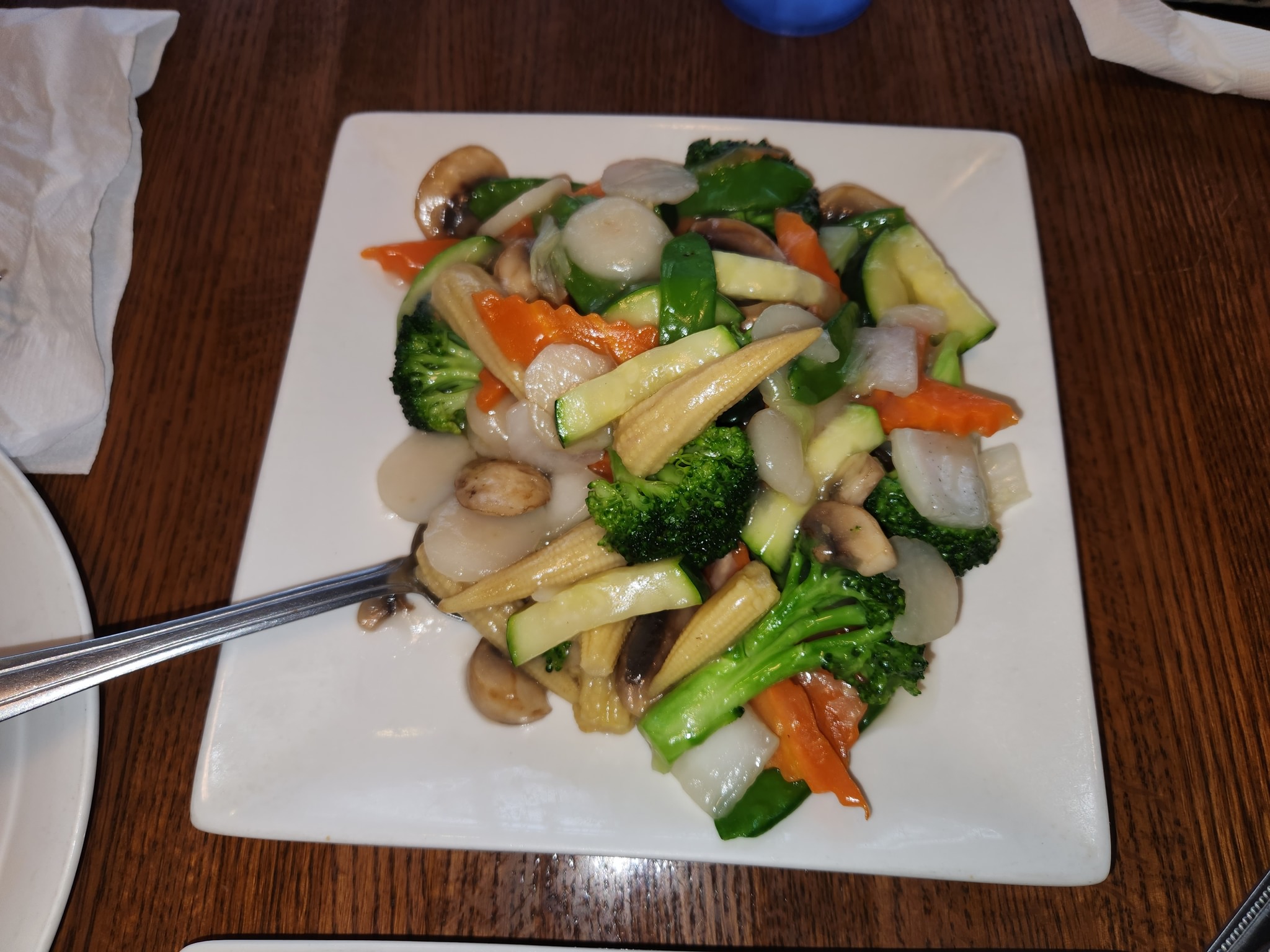 A plate full of saucy veggies from Mandarin Chinese & Sushi in Alexandria