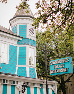 The iconic aqua blue and white exterior of Commander's Palace is a well-known sight in New Orleans.