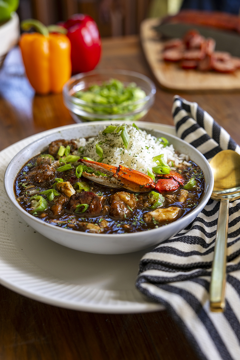 Bowl of Seafood Gumbo with crab claw and rice