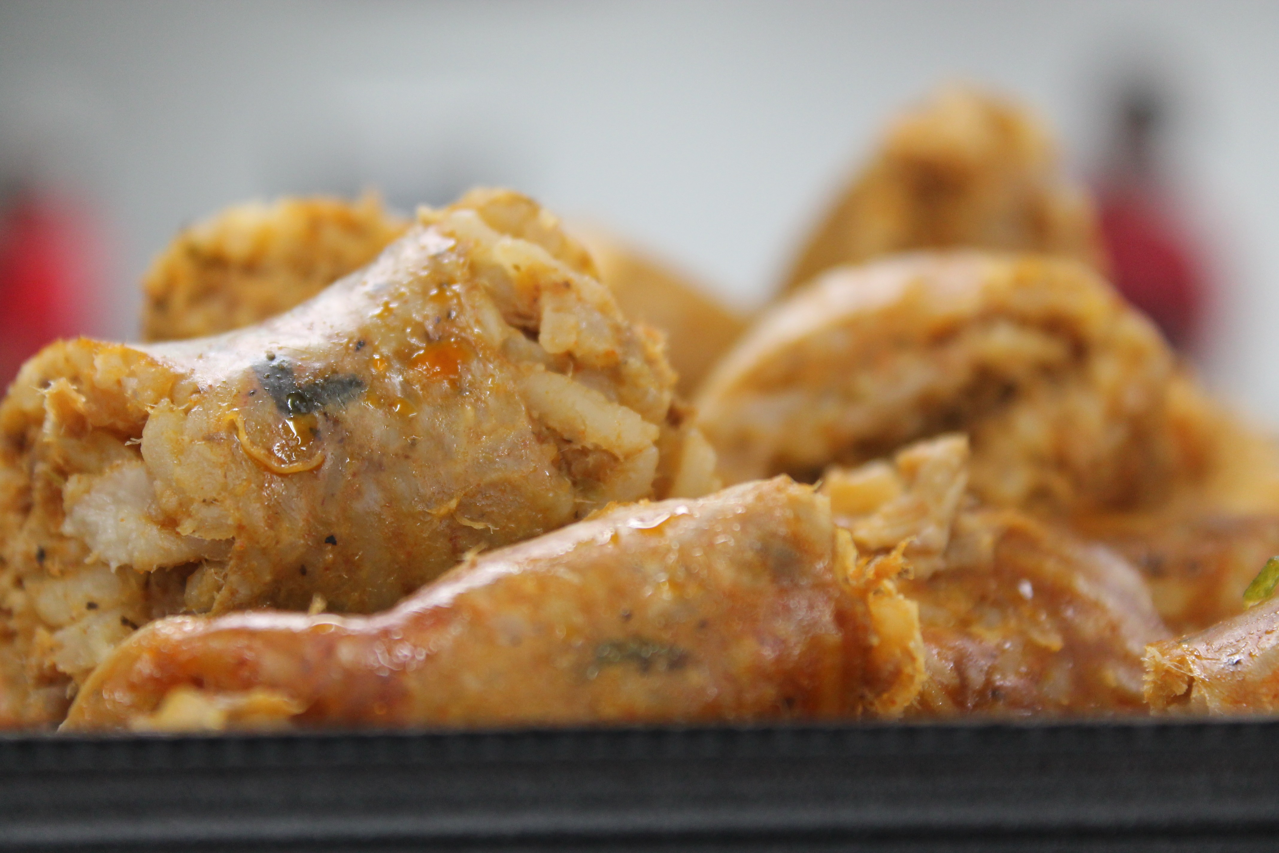 Fresh, glimmering boudin, cut open to reveal the meat-and-rice filling inside.