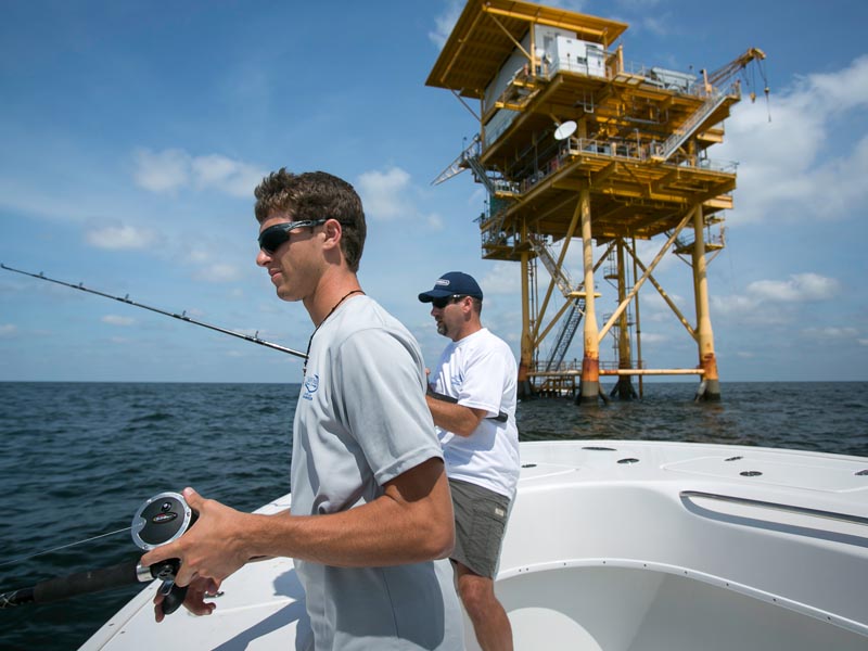 Charter fishing near an oil rig in Louisiana Charter fishing near an oil rig in Louisiana