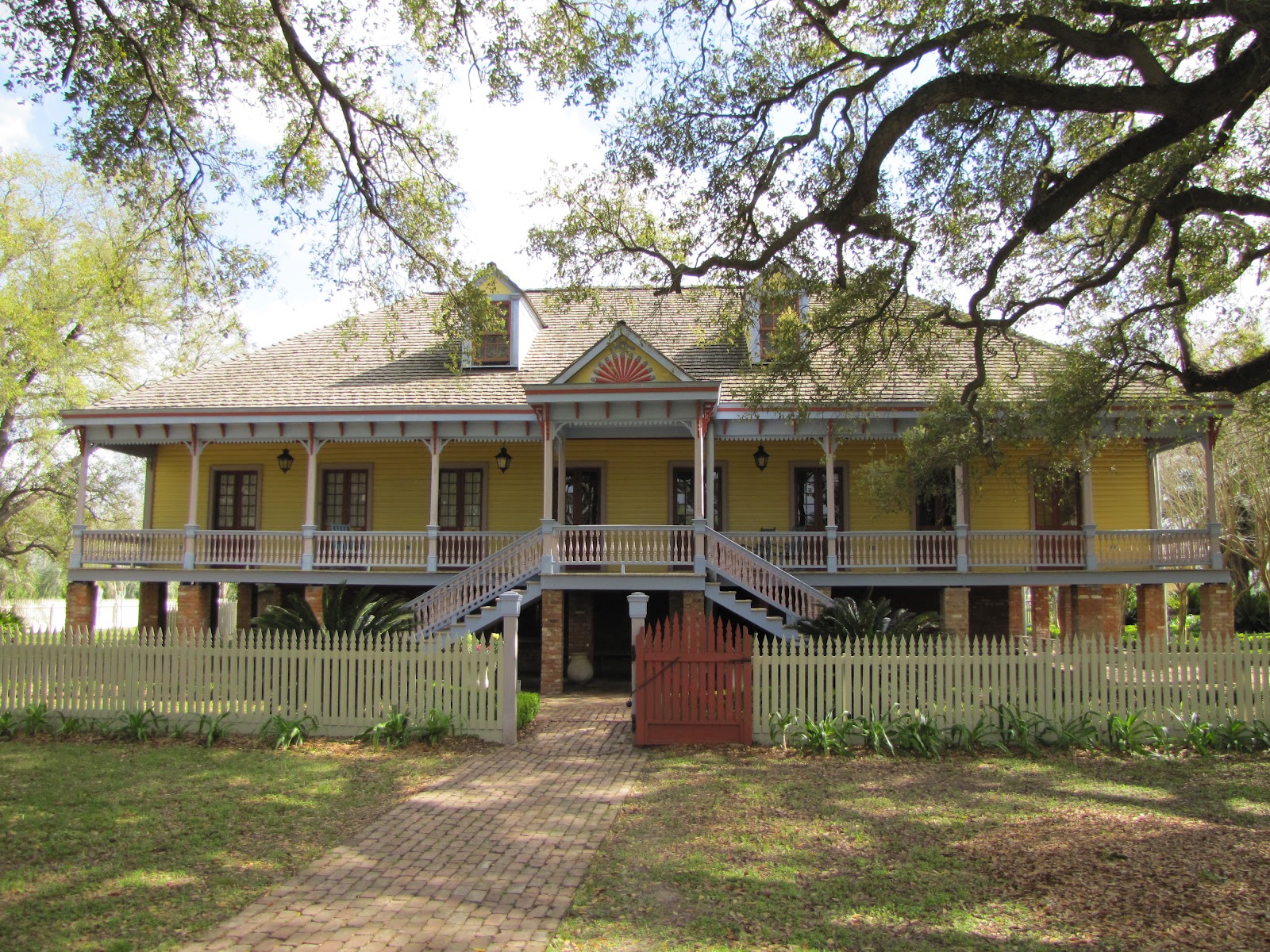 Outside of Vacherie, Louisiana, a stately, buttercup-yellow mansion stands on the grounds of the Laura Plantation.