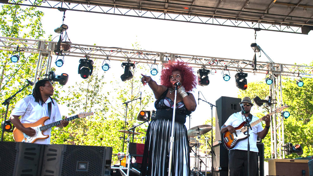 Soul performers play music for a crowd.