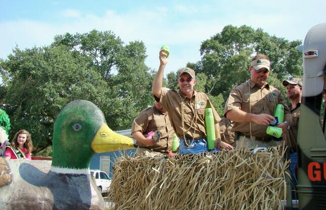 Duck hunting enthusiasts cheer at Gueydan, Louisiana's duck festival.