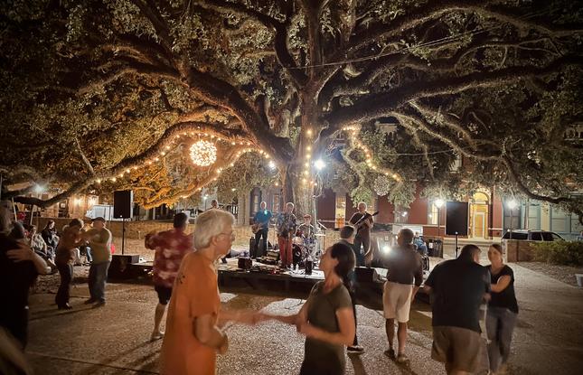 Locals dancing at Sounds on the Square, a weekly Spring concert series.
