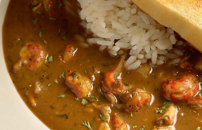 A plate of crawfish etouffe and rice.