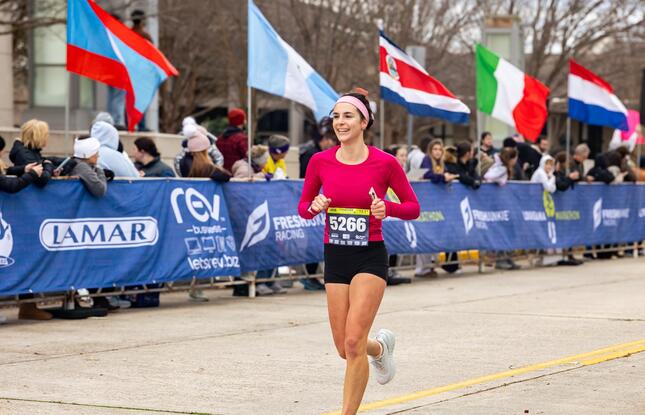 A person runs toward the finish line of a race in Louisiana.