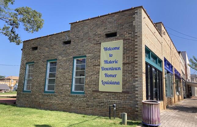 Historic Downtown Homer sign on side of brick building