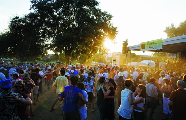 A crowd dances at Festival Acadiens et Creoles in Lafayette, Louisiana.