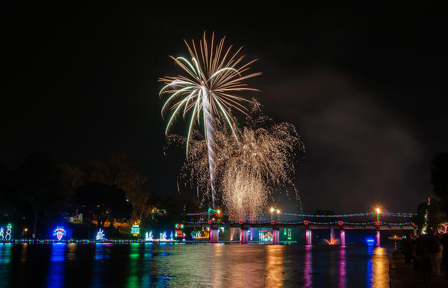 Fireworks explode over the water during Christmas celebrations in Natchitoches.