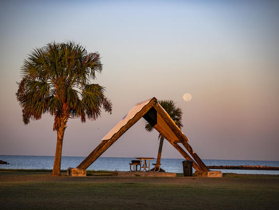 A picnic pavilion during sunset at Cypremort Point State Park.