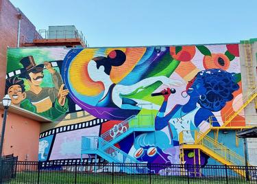 Mural celebrating the arts, on the side of the Dixie Center for Performing Arts.