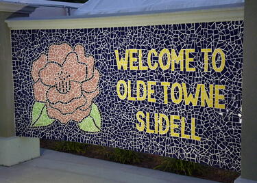 Mosaic of magnolia and Olde Towne Slidell welcome message