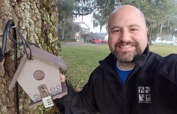 Geocacher exploring Houma caches