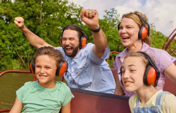 A family of four looks jovial as they cruise aboard an airboat in Louisiana.