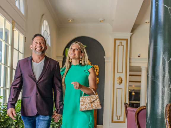 A couple walks through the lobby of the Bourbon Orleans Hotel in New Orleans.