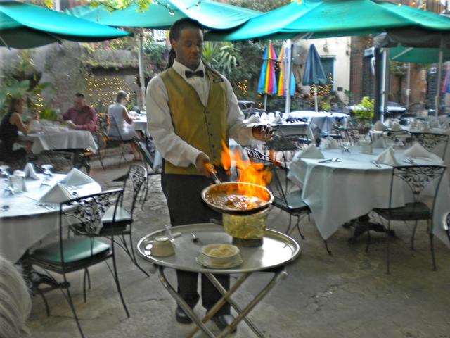 The Court of Two Sisters Courtyard Flaming Dessert at Table Side