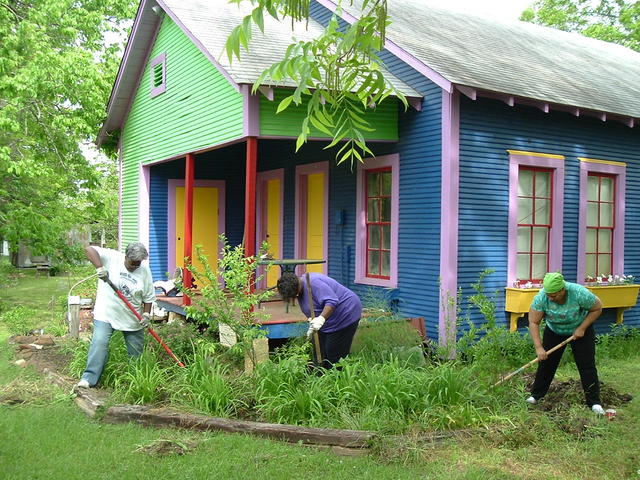 Local volunteers tend to the many gardens featuring a variety of heirloom bulbs and flowers.