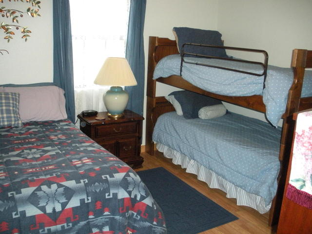 The second bedroom of the cabin has a full sized bed and a set of bunk beds.  The cabin is great from small families or up to 4 fishermen.