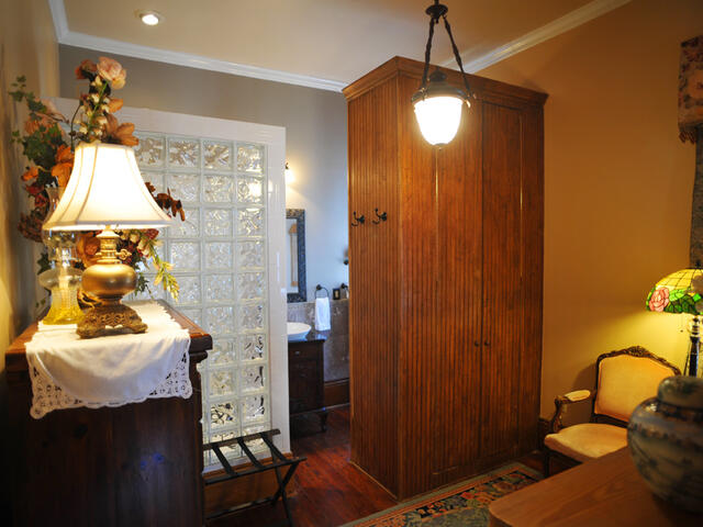 The Garden Suite offers a private ensuite bath with oversized glass-block shower.