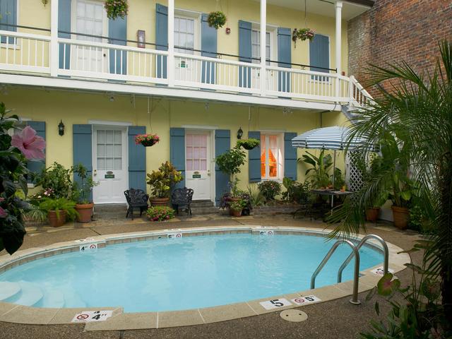 Property features courtyards surrounding two swimming pools