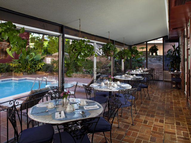 Terrace Cafe overlooking lush patio & salt water pool.