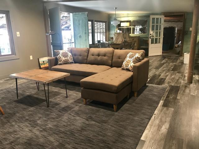 Living/dining area in the Loft, 2nd floor in The Prairie Barn. Four single beds. Open loft area.