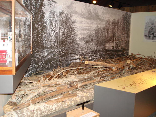 Visitors can try their hand at breaking the log jam that stymied growth on the Red River.