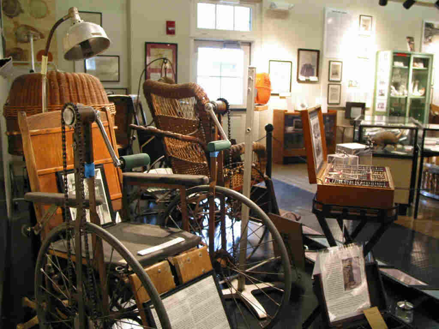 Hand-cranked wheelchairs, as well as other medical and occupational therapy tools, created just for leprosy patients, on exhibit.