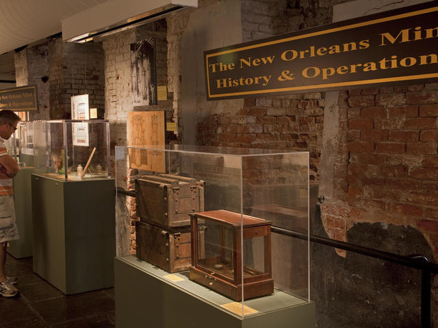 Visitors enjoy a fascinating exhibit on the history of coin-making.