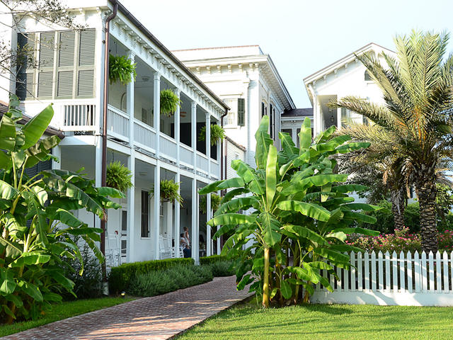 A view of the backside of the Mansion, with the Boys Wing to the left. The sidewalk leads to the Mansion Restaurant.