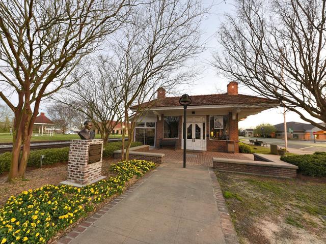 In the courtyard of the Beauregard Museum, which includes a bust of Sam Houston Jones. Photo 3