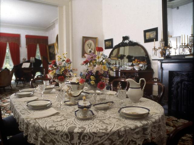 Period china and silver adorn the dining table at the 1850 House in the Pontalba Apartments.