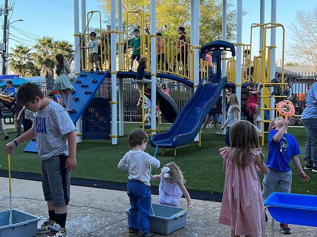 Kids enjoying the playground at the Kiwanis of Acadiana "Harmony Park" at the CMA