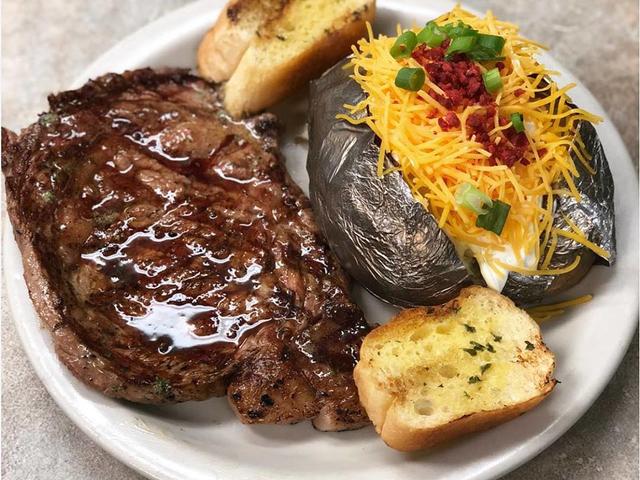 14 ounce Rib Eye Steak with a loaded baked potato