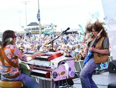 A band performs live at the Hogs for the Cause festival.