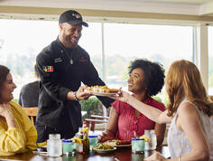 Guests enjoy a meal at Orlandeaux's Cafe.