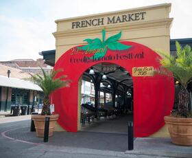 The French Market entrance is decorated to look like a bright red tomato.