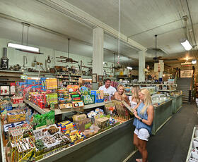 A woman purchases candy.