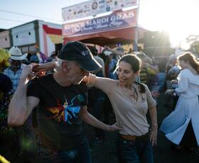 Two people dance at a Mardi Gras celebration in Eunice, Louisiana.