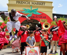 A marching band performs in front of the French Market.