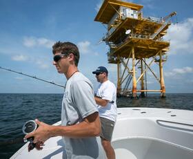 Charter fishing near an oil rig in Louisiana